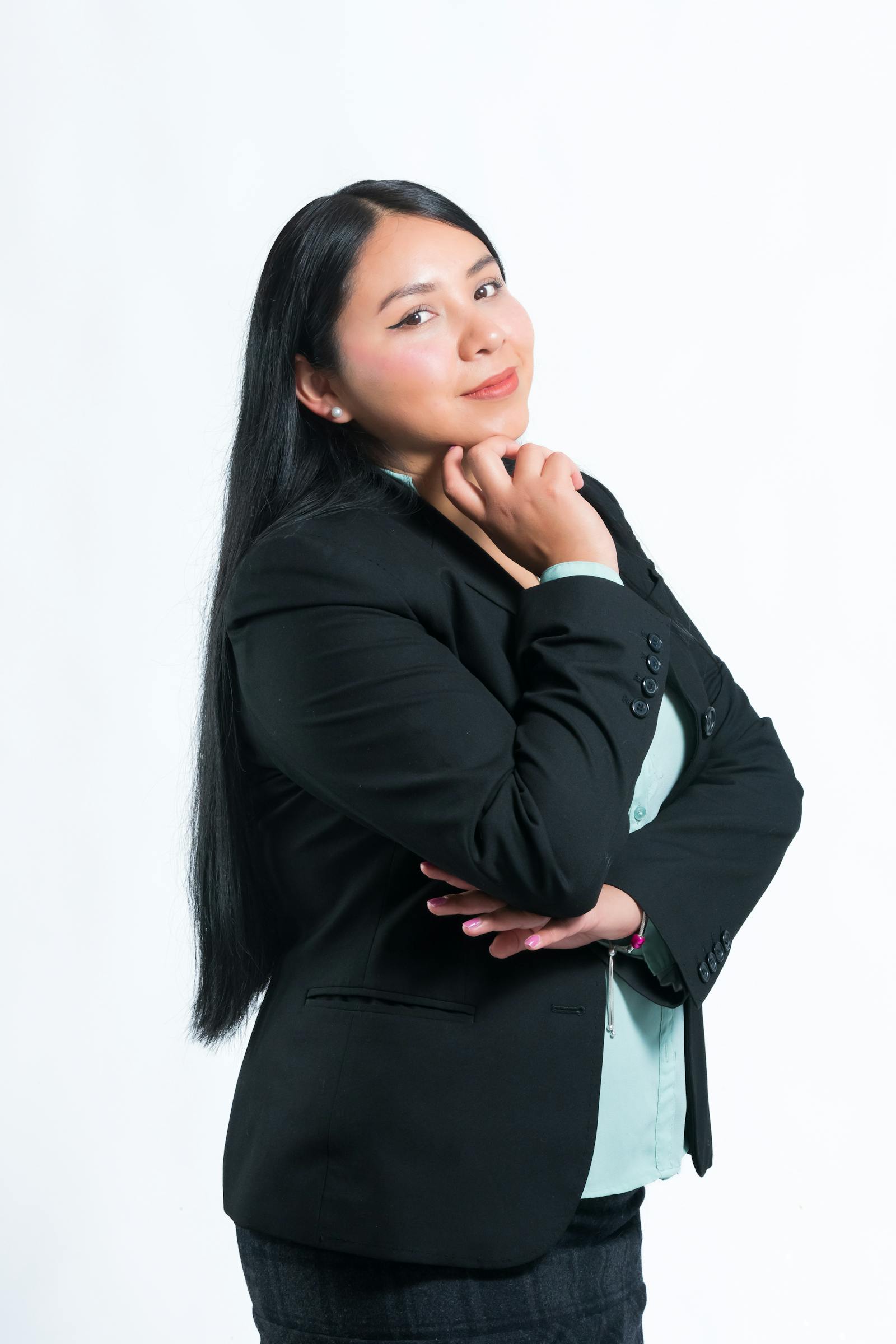Studio portrait of Mira Halden, founder of Lumina Studio, in a navy linen overshirt.